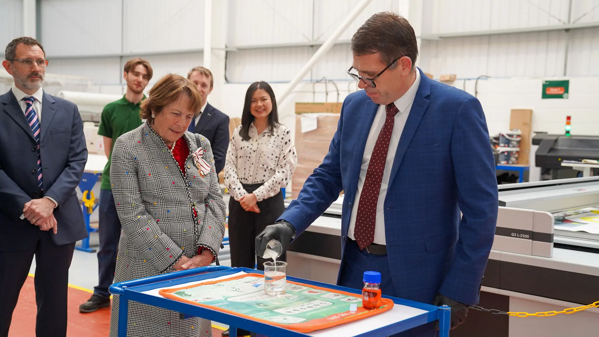 Green Rhino employee showing the smart polymer in action as part of the innovative Neutroilize™ Smart Fabric Technology for pollution prevention.